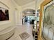 Inviting entryway featuring tile floors, arched doorways, and a view into the spacious living area at 15207 17Th E Ave, Bradenton, FL 34212