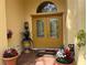 Inviting front entrance with double doors, potted plants, and decorative touches for a welcoming curb appeal at 15207 17Th E Ave, Bradenton, FL 34212