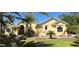 Beautiful home showcasing vibrant landscaping, a well-maintained lawn, and a welcoming facade at 15207 17Th E Ave, Bradenton, FL 34212