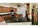 Gourmet kitchen with granite counters, modern appliances, custom cabinets, and a functional center island at 15207 17Th E Ave, Bradenton, FL 34212