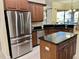 Modern kitchen with stainless steel appliances, granite countertops, and a center island at 15207 17Th E Ave, Bradenton, FL 34212