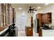 Bright kitchen featuring a center island, stainless steel appliances, wooden cabinets, and ample counter space at 15207 17Th E Ave, Bradenton, FL 34212