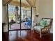 Relaxing room with a cozy chair offering seamless access to a screened lanai with outdoor seating at 15207 17Th E Ave, Bradenton, FL 34212