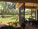Lanai overlooking water with landscaped yard and a table and chairs at 15207 17Th E Ave, Bradenton, FL 34212