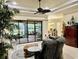 Bright living room featuring sliding glass doors to the patio and a view of the backyard at 15207 17Th E Ave, Bradenton, FL 34212