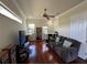 Relaxing living room with plenty of natural light, comfortable seating, and workspace at 15207 17Th E Ave, Bradenton, FL 34212