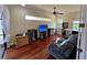 Comfortable living room with hardwood floors, a ceiling fan, and plenty of natural light at 15207 17Th E Ave, Bradenton, FL 34212
