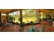Spacious screened-in patio with comfortable seating and views of the lush backyard and waterfront at 15207 17Th E Ave, Bradenton, FL 34212