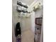 Utility room featuring a water heater, shelving, and space for storage, providing practicality and organization at 15207 17Th E Ave, Bradenton, FL 34212