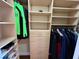 Spacious walk-in closet with built-in shelving, drawers, and hanging rods for optimal organization at 15207 17Th E Ave, Bradenton, FL 34212