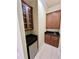Convenient wet bar with cabinets, granite countertop, and a mini-fridge at 15207 17Th E Ave, Bradenton, FL 34212