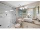 Modern bathroom with a glass-enclosed shower, toilet, and vanity with vessel sink at 276 Cerromar Way # 60, Venice, FL 34293