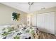 Inviting bedroom featuring a comfortable bed, ceiling fan, and spacious closet at 276 Cerromar Way # 60, Venice, FL 34293