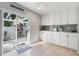 Kitchen area featuring stainless steel appliances, sliding door, and ample cabinet space at 276 Cerromar Way # 60, Venice, FL 34293