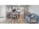 Combined living and dining area with cozy seating and updated flooring at 276 Cerromar Way # 60, Venice, FL 34293