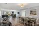 Spacious living area with comfortable seating, dining table, and seamless flow at 276 Cerromar Way # 60, Venice, FL 34293