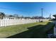 Well-maintained lawn with a white fence providing privacy in the backyard of this property at 3403 36Th W St # 109, Bradenton, FL 34205