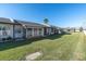 Exterior view of the property with well-kept lawn at 3403 36Th W St # 109, Bradenton, FL 34205