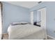 Bright bedroom features carpet, a window with curtains, and mirrored closet at 3403 36Th W St # 109, Bradenton, FL 34205