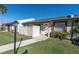 Inviting townhome with a well-kept lawn and a quaint, fenced-in front porch at 3403 36Th W St # 109, Bradenton, FL 34205