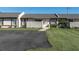 Charming townhome featuring a well-maintained lawn and paved driveway at 3403 36Th W St # 109, Bradenton, FL 34205