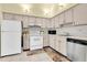 Efficient kitchen with clean white appliances and ample counter space at 3403 36Th W St # 109, Bradenton, FL 34205
