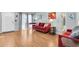 Bright living room featuring wood floors, a cozy sofa, and natural light at 3403 36Th W St # 109, Bradenton, FL 34205