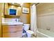 Updated bathroom with modern vanity, stylish fixtures, and shower-tub combination at 3500 El Conquistador Pkwy # 336, Bradenton, FL 34210
