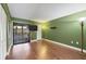 Room featuring a closet, a TV on the wall, a ceiling fan and an access to a patio at 3500 El Conquistador Pkwy # 336, Bradenton, FL 34210