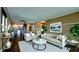 Bright living room featuring modern decor, neutral tones, and seamless access to the kitchen at 3500 El Conquistador Pkwy # 336, Bradenton, FL 34210