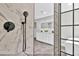 Bathroom offering a vanity with backlit mirror and tile and glass enclosed shower stall with black matte hardware at 3651 Walden Pond Dr, Sarasota, FL 34240