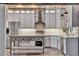 Modern kitchen with stainless steel appliances, center island, and ample counter space at 3651 Walden Pond Dr, Sarasota, FL 34240