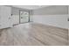 Well-lit living room with wainscoting and patio door access to the backyard at 3651 Walden Pond Dr, Sarasota, FL 34240
