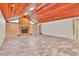 Spacious living room with wood ceiling, brick fireplace, and tiled floors at 3651 Walden Pond Dr, Sarasota, FL 34240
