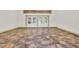 Open living room featuring a decorative ceiling and large windows at 3651 Walden Pond Dr, Sarasota, FL 34240