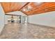 Spacious living room featuring a beautiful wood ceiling and tile floors at 3651 Walden Pond Dr, Sarasota, FL 34240