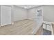 Upstairs loft with closet and railing overlooking the stairwell entrance at 3651 Walden Pond Dr, Sarasota, FL 34240