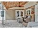 Relaxing covered patio area with comfortable seating and string lights at 3651 Walden Pond Dr, Sarasota, FL 34240