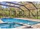 The screened pool has a spa and lots of room for swimming and relaxing at 3651 Walden Pond Dr, Sarasota, FL 34240
