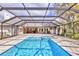 The screened pool has a spa and lots of room for swimming and relaxing at 3651 Walden Pond Dr, Sarasota, FL 34240