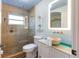Bathroom featuring a glass-enclosed shower and stone vessel sink at 3951 Palau Dr, Sarasota, FL 34241