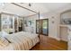 Spacious main bedroom features a canopy bed and French doors that open to the outdoors at 3951 Palau Dr, Sarasota, FL 34241