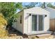 Quaint cottage with sliding glass doors on a pebble lined property at 3951 Palau Dr, Sarasota, FL 34241