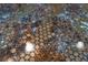 Close-up of a penny-covered countertop sealed under a clear, glossy finish at 3951 Palau Dr, Sarasota, FL 34241