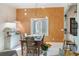 Well-lit dining room with contemporary chandelier, indoor garden, and an open floorplan at 3951 Palau Dr, Sarasota, FL 34241