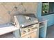 Outdoor built-in KitchenAid grill on tile countertop at 3951 Palau Dr, Sarasota, FL 34241