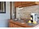 Convenient outdoor kitchen space, complete with sink, tiled countertop and coffee machine at 3951 Palau Dr, Sarasota, FL 34241