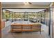 Stylish screened patio with comfortable seating, overlooking a lush backyard at 3951 Palau Dr, Sarasota, FL 34241