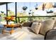 Tranquil patio nook with plush seating and a tray table, perfect for relaxing outdoors at 3951 Palau Dr, Sarasota, FL 34241