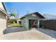 Exterior view of the green shed with open garage door at 3951 Palau Dr, Sarasota, FL 34241